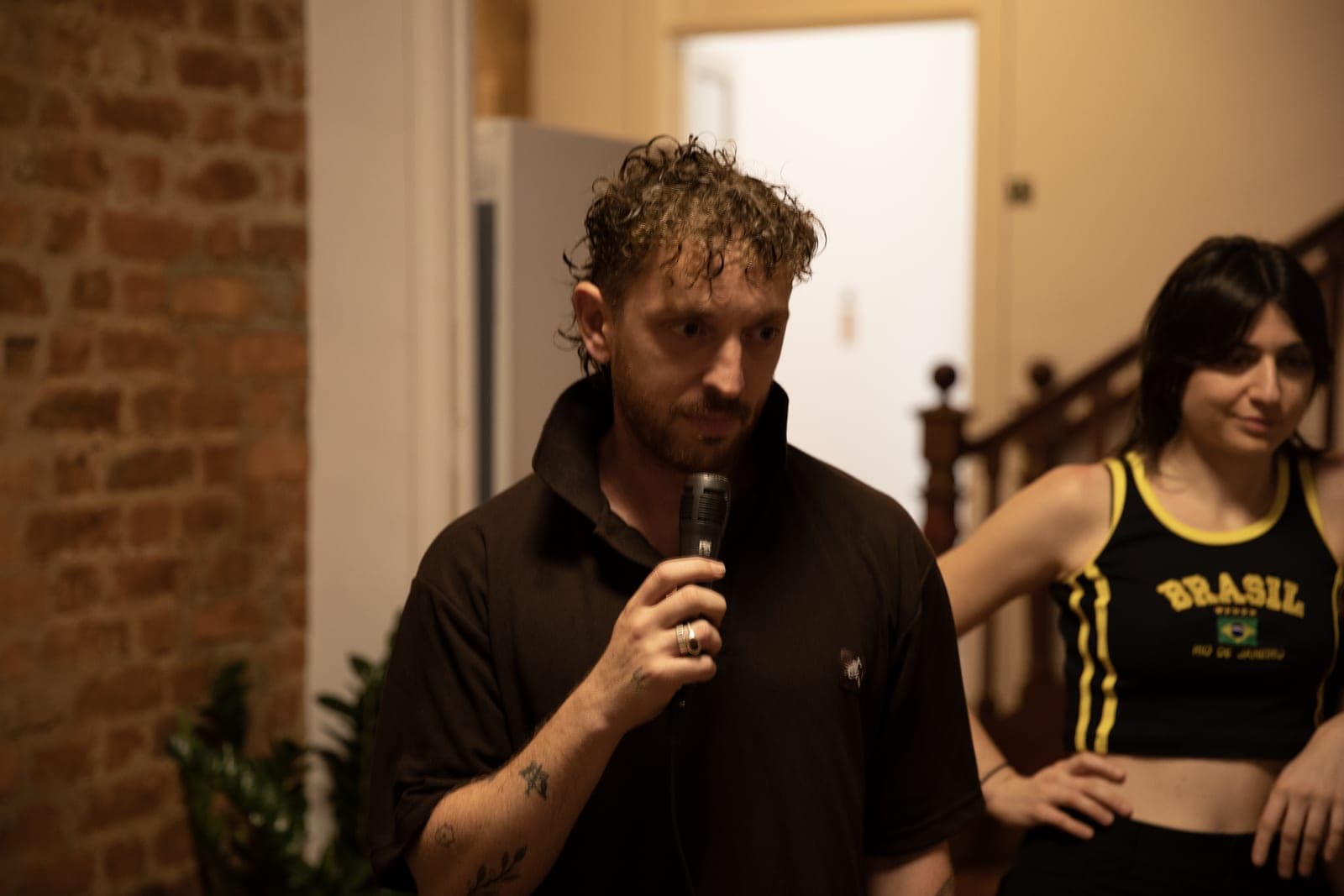 A guest singing karaoke on a night in at the hostel