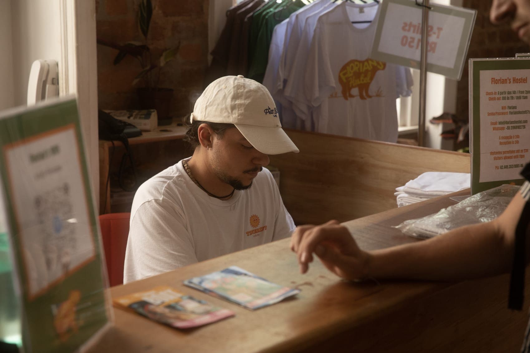Reception, with Florian's Hostel merch on display