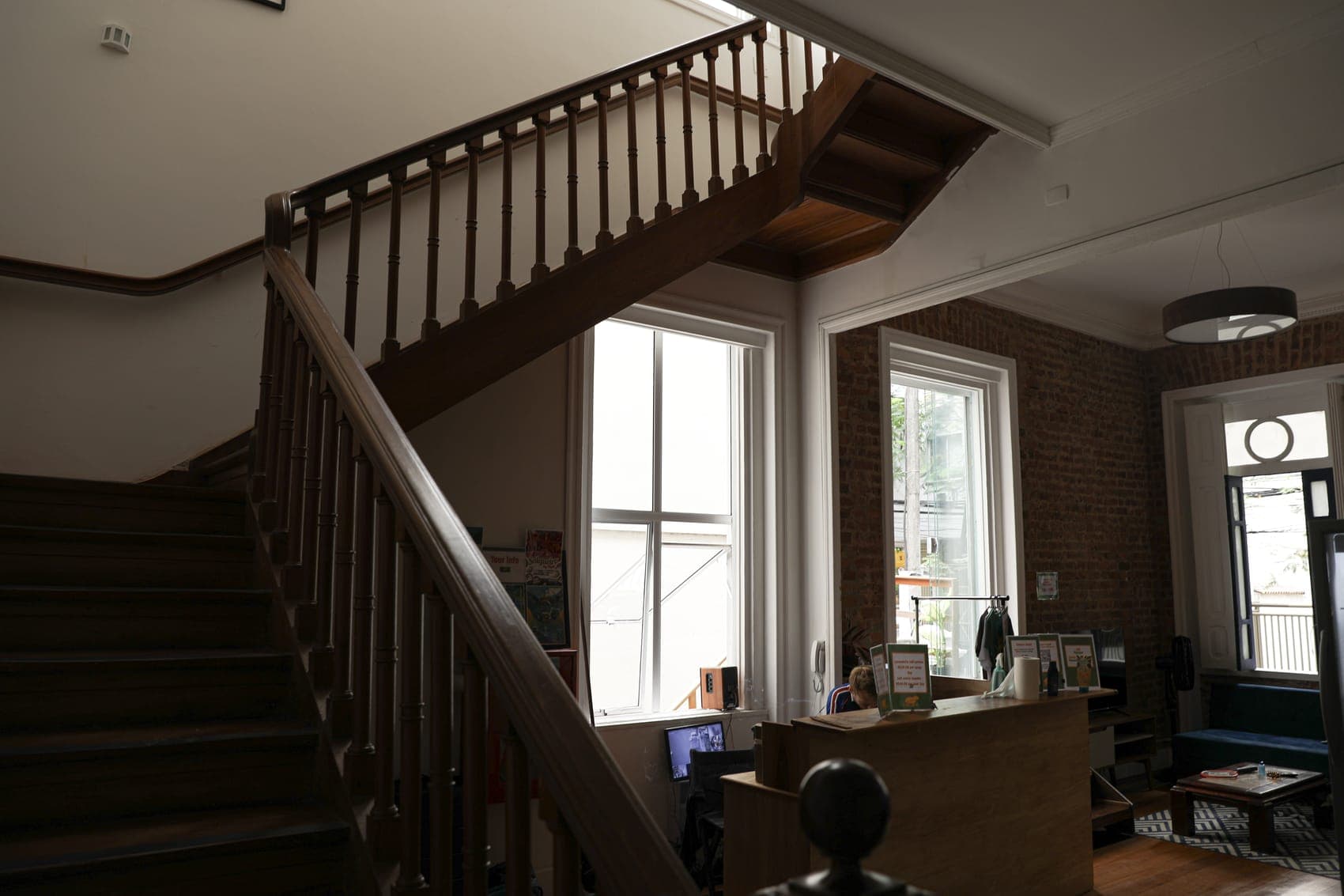 The characterful wooden staircase and brick-walled reception